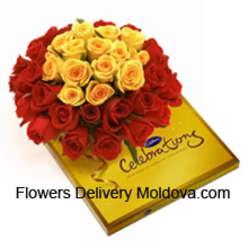 Bouquet de 24 roses rouges et 11 roses jaunes avec des remplissages saisonniers accompagnés d'une belle boîte de chocolats Cadbury assortis