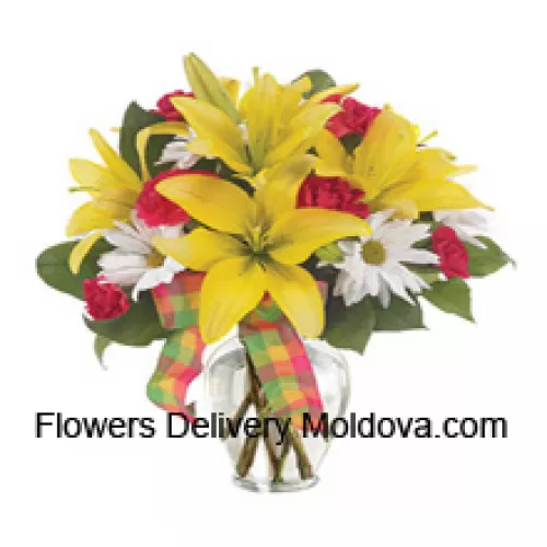 Yellow Lilies, Red Carnations And Suitable Seasonal White Flowers Arranged Beautifully In A Glass Vase