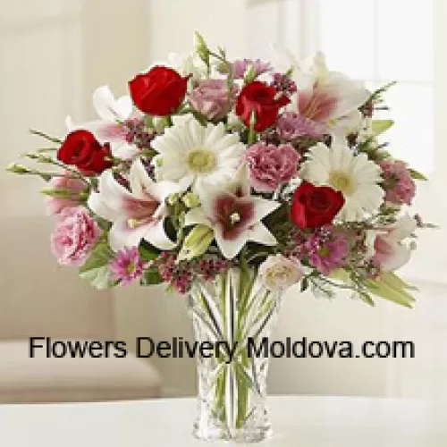 Red Roses, Pink Carnations White Gerberas And White Lilies With Other Assorted Flowers In A Glass Vase